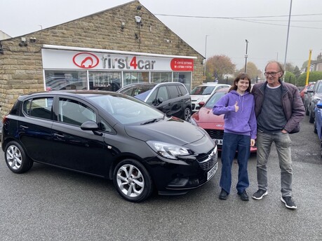 Emily & her dad collecting her new car on a miserable wet day