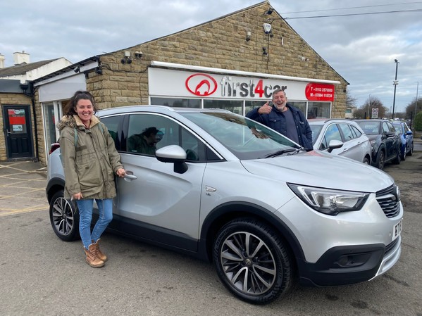 Alecs partner and her dad collecting their new Crossland