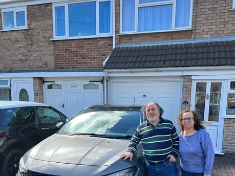 Happy customers receiving their new car in Cannock