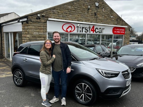 Joseph and Amy collecting their new car
