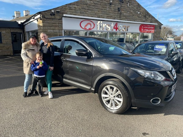 Leah and her family collecting her new car 