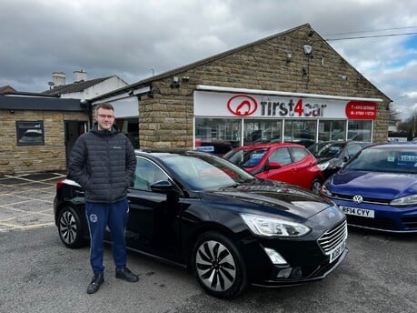 Daniel collecting his new focus