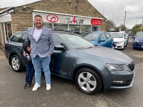 Ben and his son collecting their new Skoda Octavia