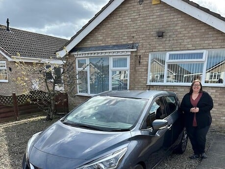 Heather receiving her new car in York