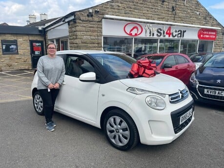 Jackie picking up her new car after recently passing her test