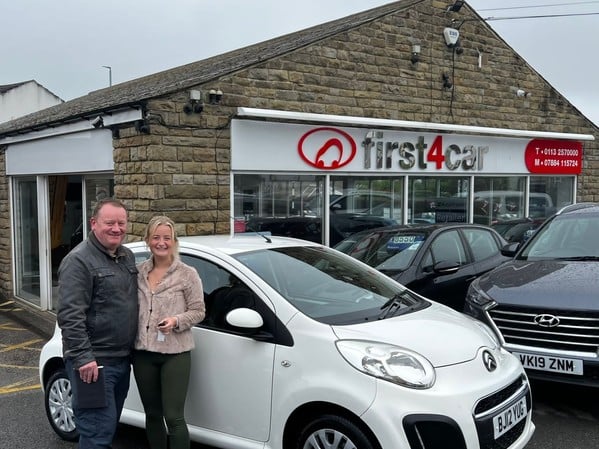 Connie and her dad collecting her new car