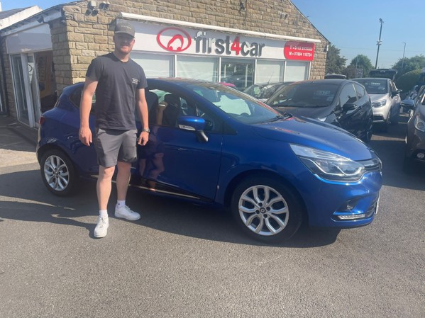 James collecting his new Clio 