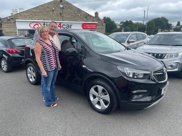 Tracey and her husband collecting their new Mokka