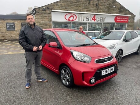 Louise and Lee from Pudsey picking up their 3rd car from First4car