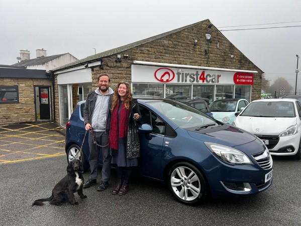 Charles, Jessica and Indie from Liverpool collecting their new Vauxhall Meriva