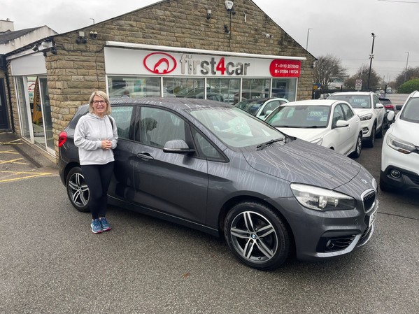 Sara from Pudsey collecting her new car before her move to London