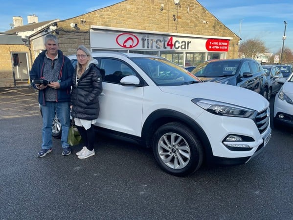 Deborah and her partner from Ilkley collecting their new Tucson