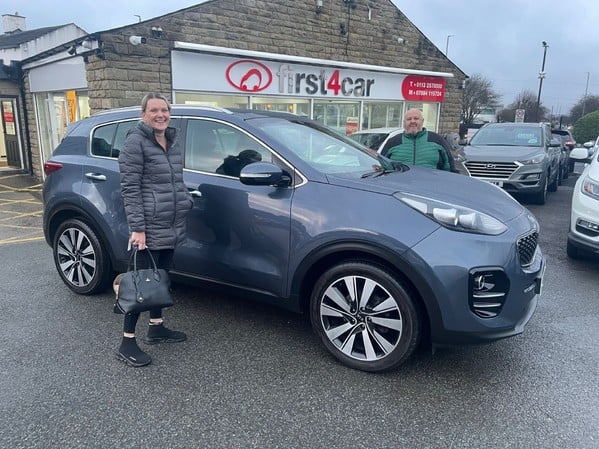 Robert and family from Bradford collecting their new Sportage