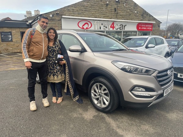 Sandeep and his wife from Leeds collecting their new Tucson