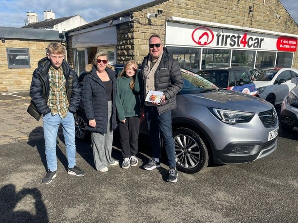 Matthew and his family from Bradford collecting their new Crossland