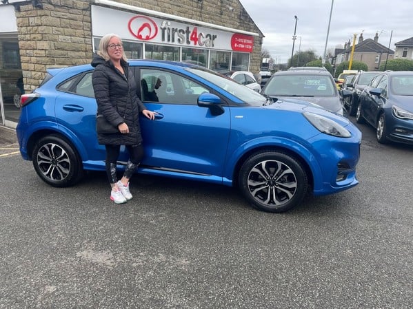 Mrs Carr from Leeds collecting her new Puma