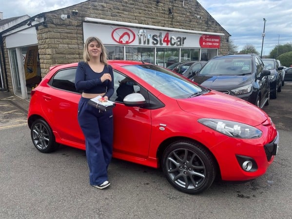 Katie from Pudsey collecting her new car 