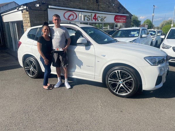 Steven and his Partner from Leeds collecting their new BMW