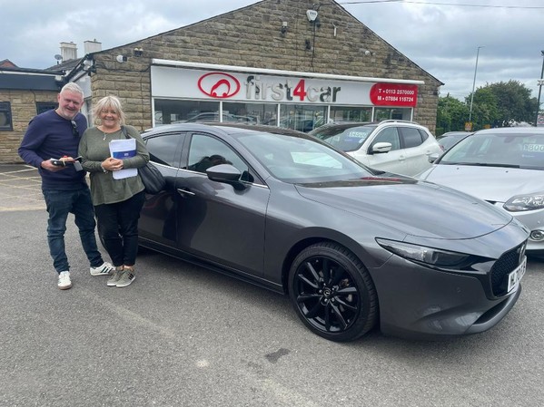 Adrian and Lesley from Manchester collecting their new Mazda 3 