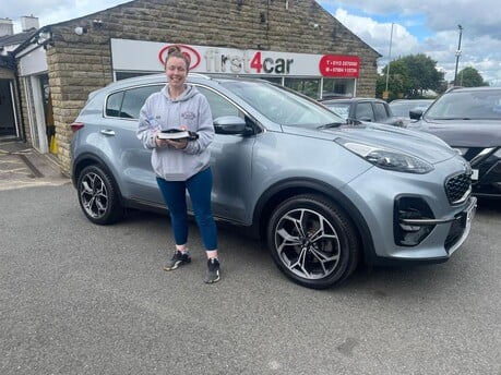 Katie from Leeds collecting her new Kia 