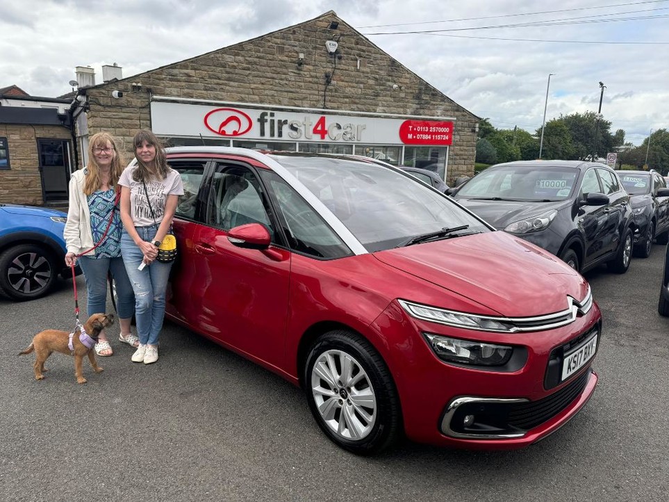 Catherine and her family collecting their new Citroen.
