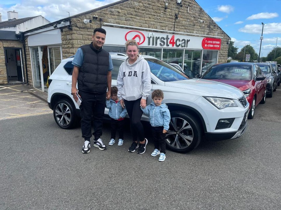 Jeremiah and his family collecting their new Seat Ateca.