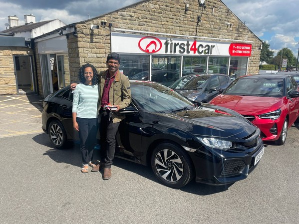 Arvind and his wife from Leeds collecting their new Honda Civic.