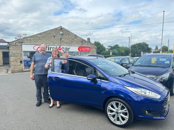 Diane and her husband collecting their new Ford Fiesta.