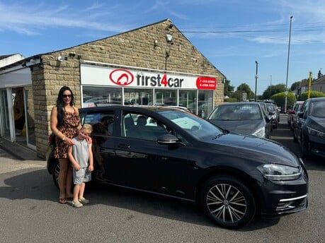 Ami and her son from Bradford collecting their new Golf.