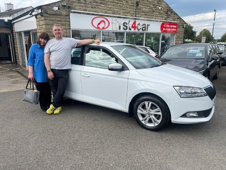 Steve and his wife from Leeds  collecting their new Skoda their 9th car from us