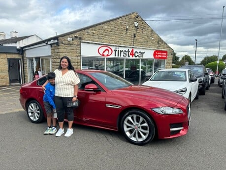 Dream and her son from Nottingham collecting their new Jaguar.