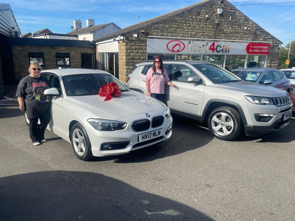 Best friends Cheryl and Georgina collecting their new BMW and Jeep. 