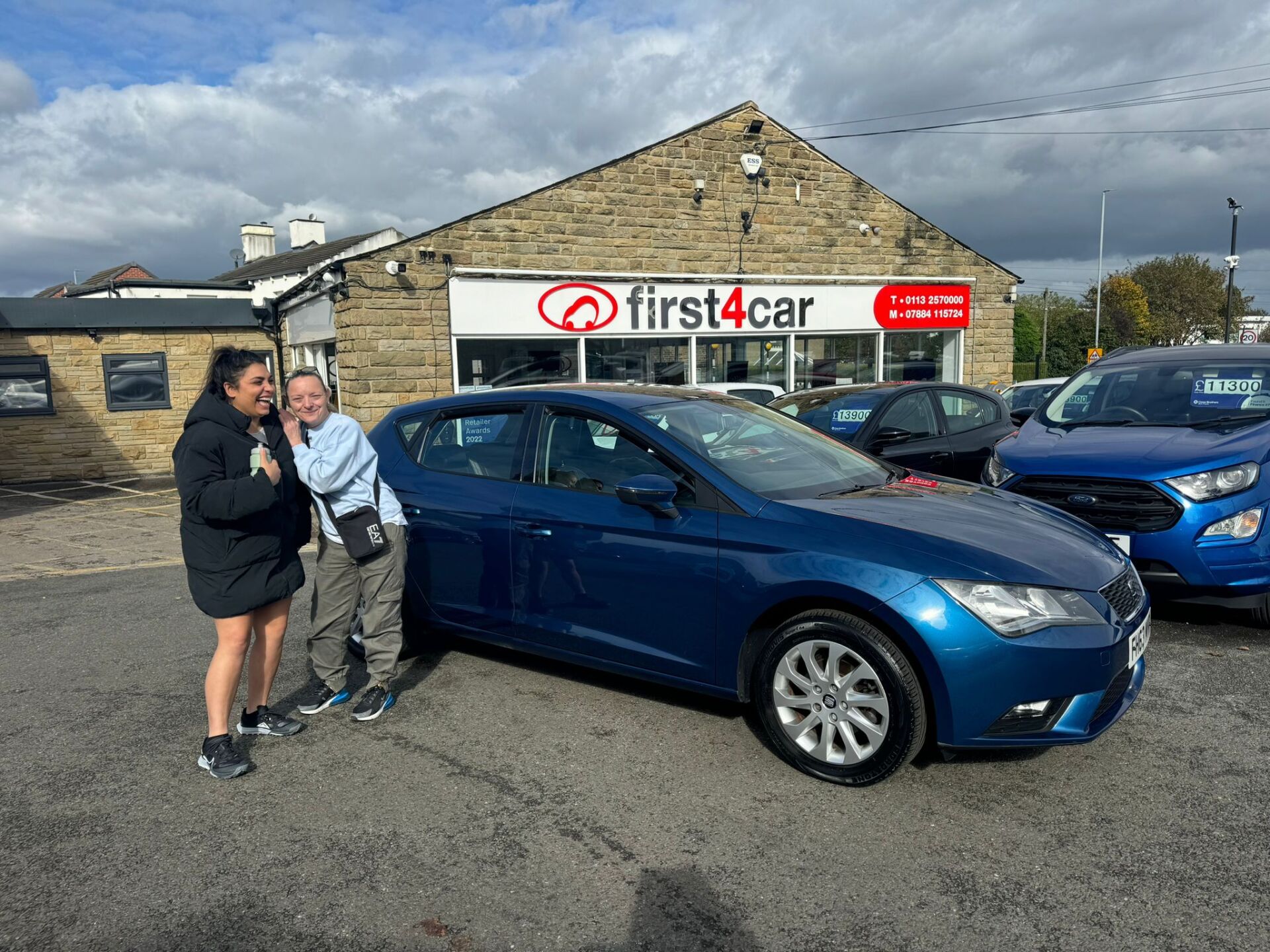 Lynette and her friend from Manchester collecting her new Seat Leon