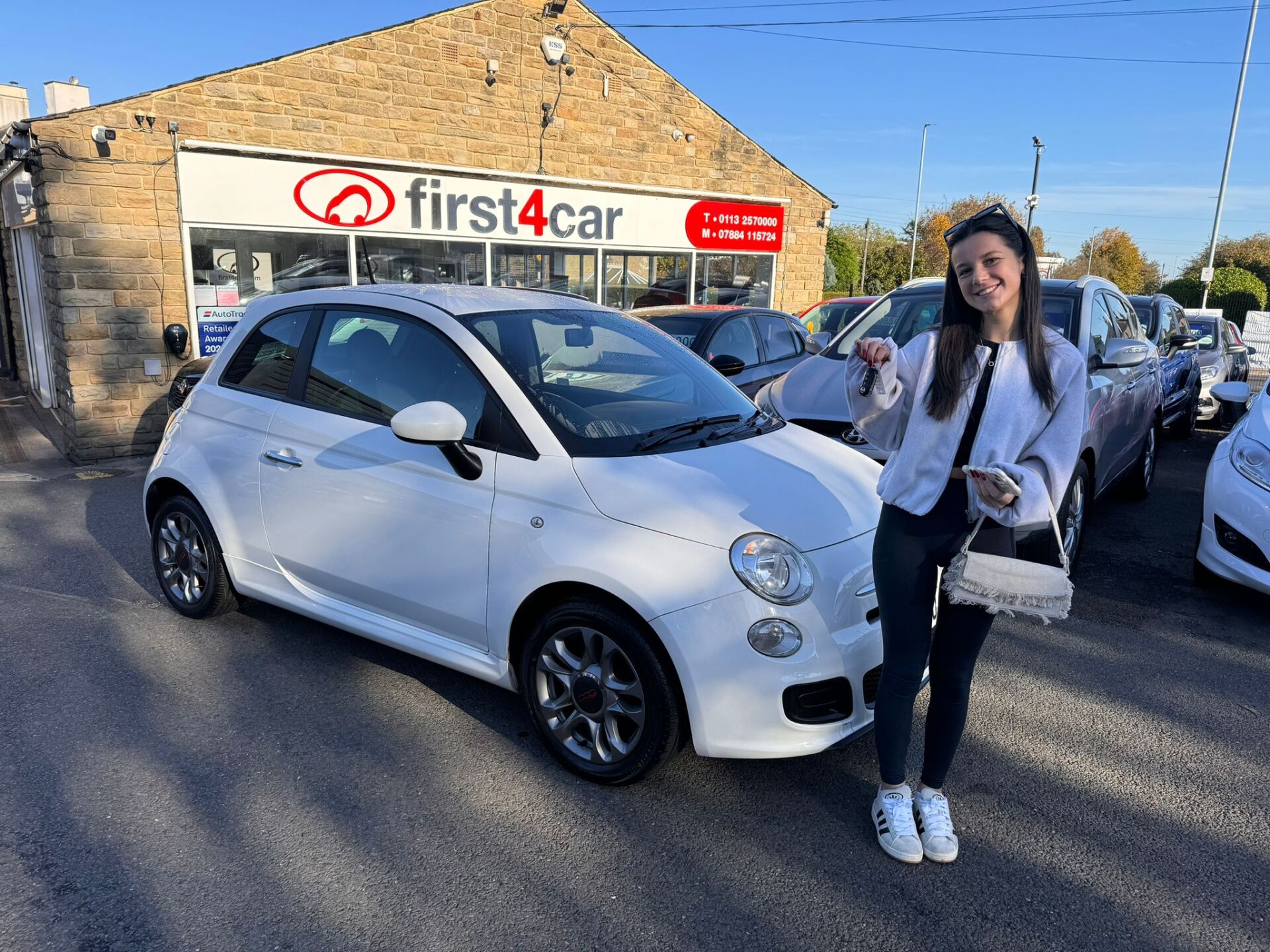 A very happy Brooke from Bradford collecting her first car a Fiat 500.