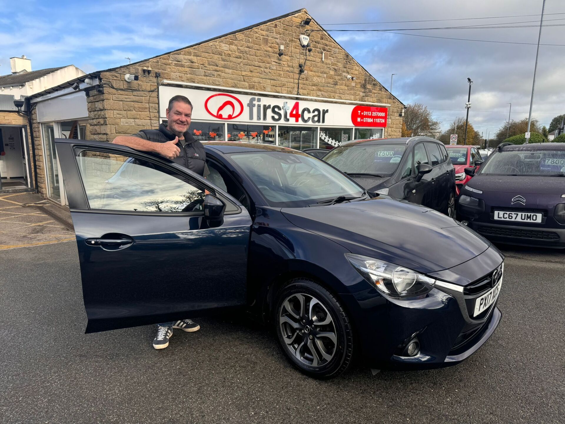 Nigel from Pudsey collecting a new Mazda 2 for his wife