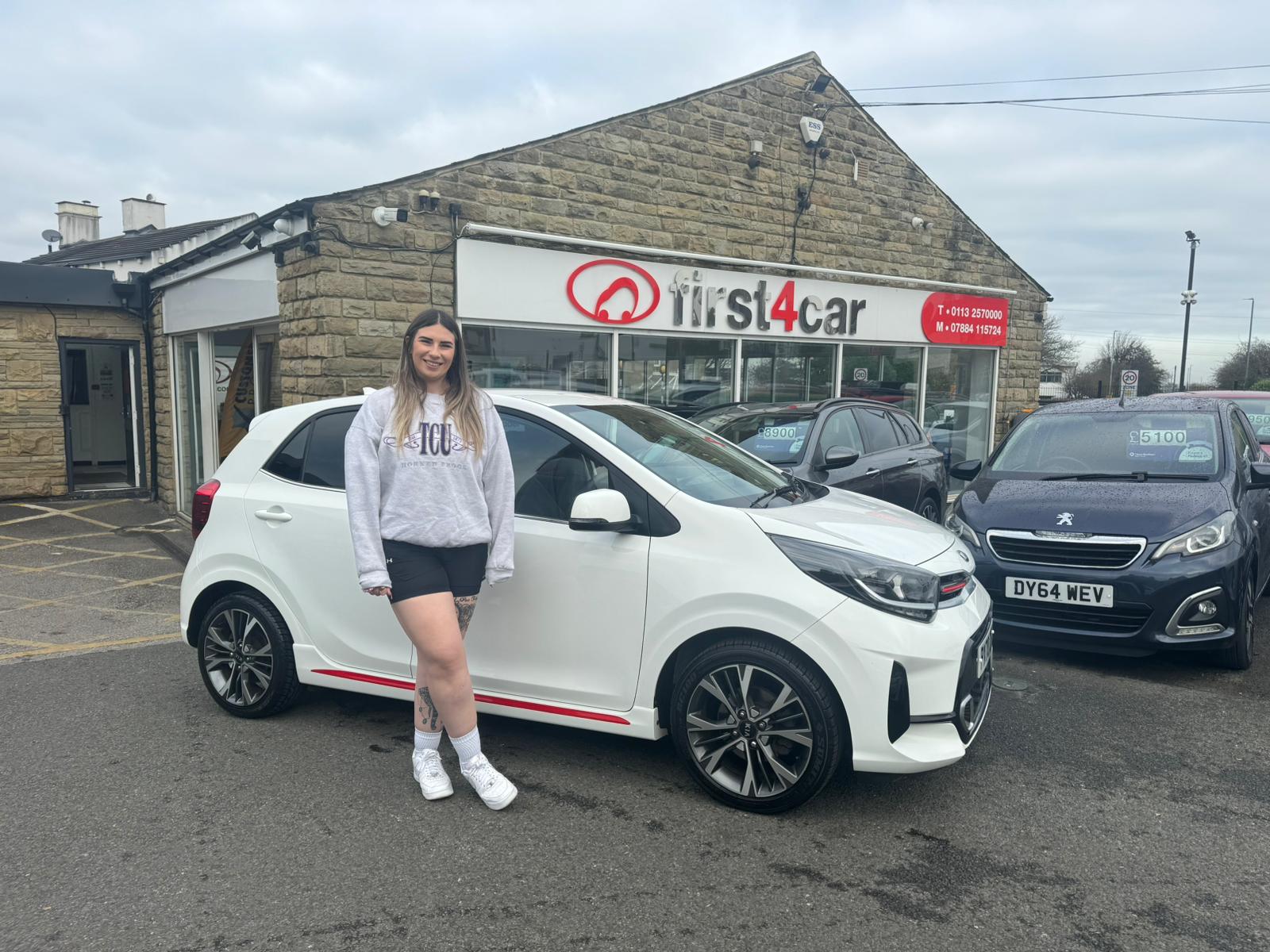 Lauren from Leeds collecting her first car a lovely Kia Picanto.