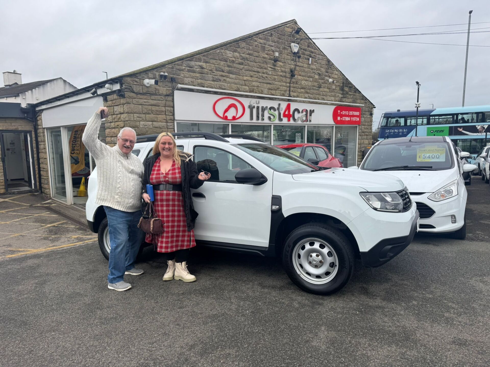 Hailey and her dad collecting her new Dacia Duster.