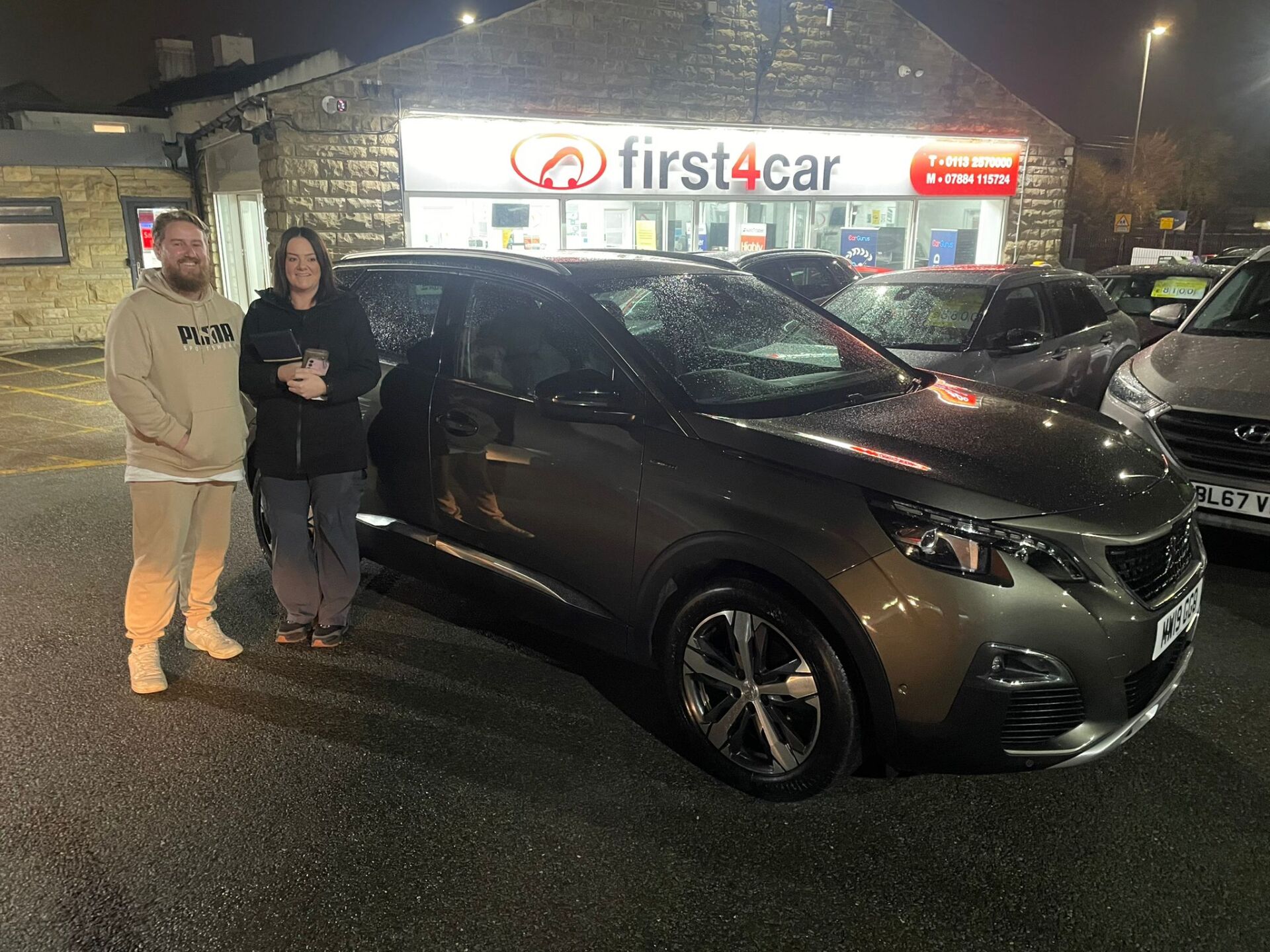 Rachel and her partner from Baildon collecting their new Peugeot.