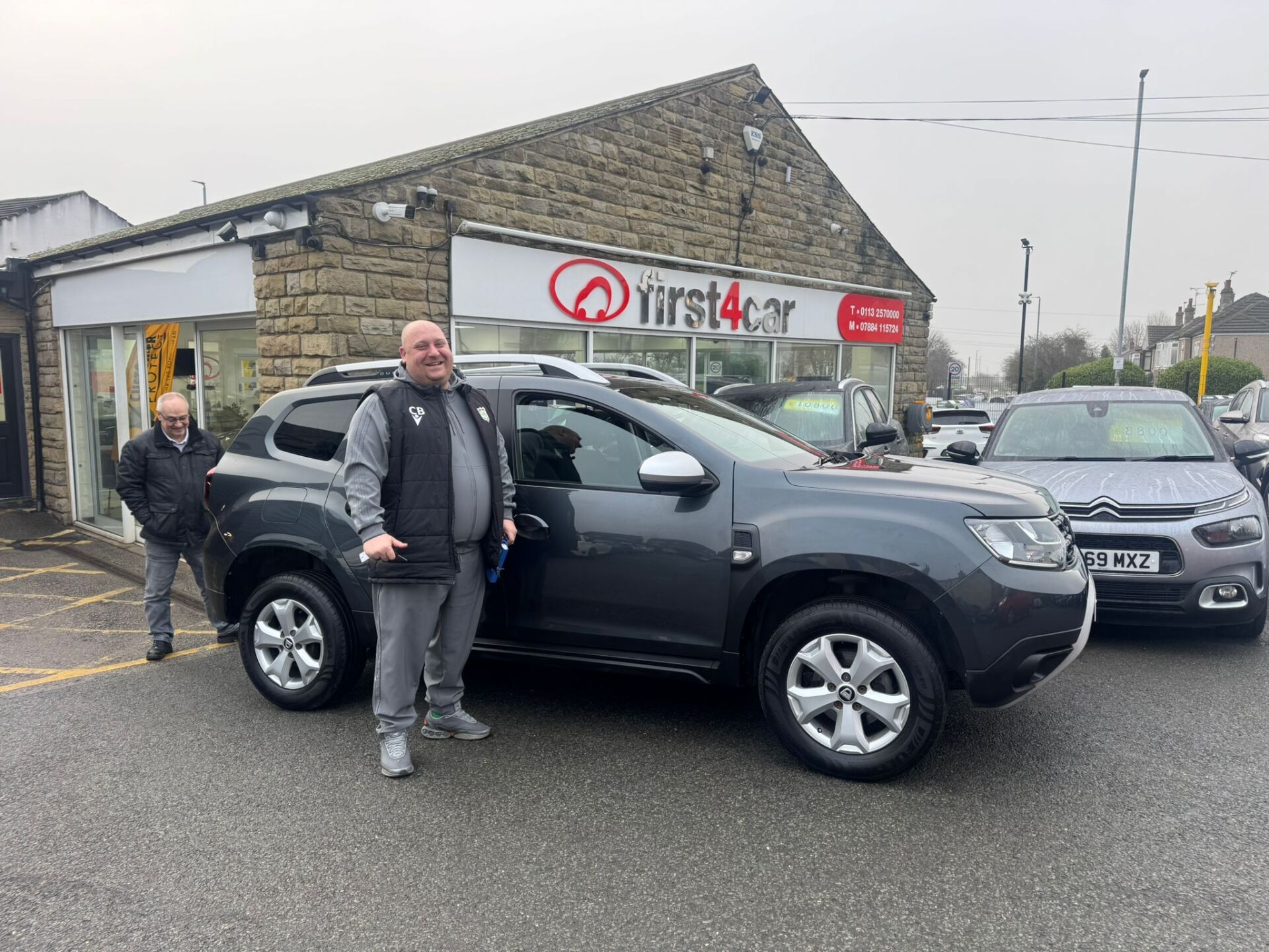 Chris and his Dad from Leeds collecting their new Dacia.