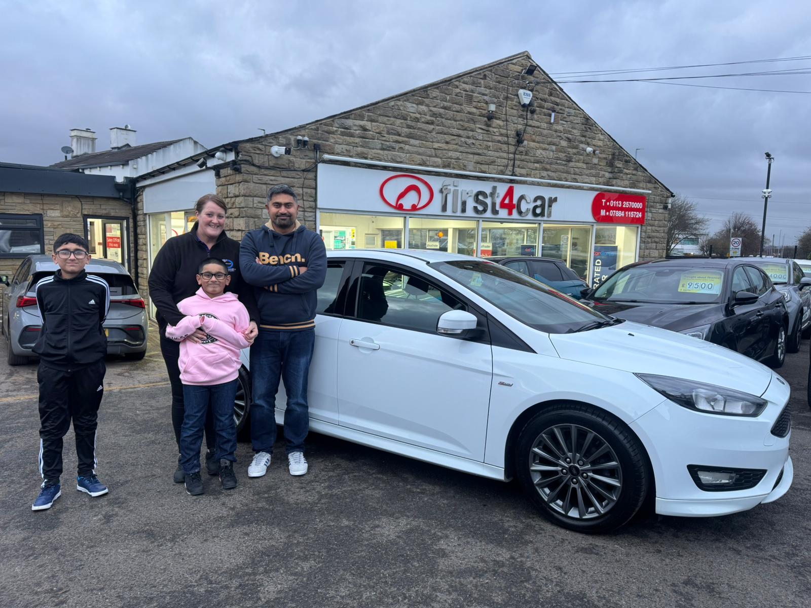 Saj and his family from Leeds collecting their new Ford Focus.