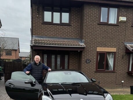 Paul taking delivery of his Mercedes SLC cabriolet in Manchester.