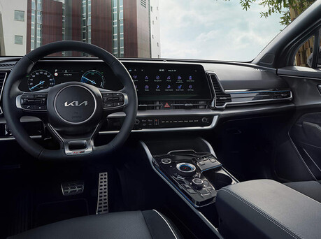 Image of steering wheel and technology inside the Sportage.