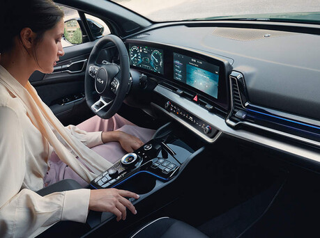 Image of someone sitting in the driver's seat.