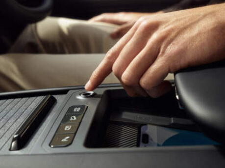Image of someone placing finger on fingerprint recognition.