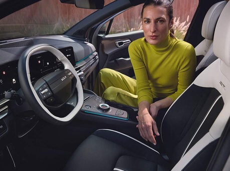 Image of woman sitting in the cabin of the new Kia Sportage.