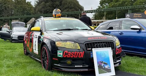 Black and yellow Audi touring car replica with Castrol and Dunlop livery on display at Simply Audi 2025.