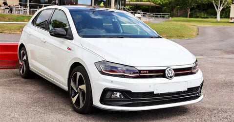 White Volkswagen Polo GTI parked at Beaulieu during Simply VW 2025 event.