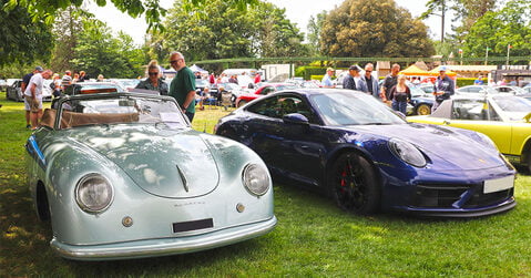 Classic Porsche 356 parked beside a modern Porsche 911 at Simply Porsche 2025, Beaulieu.